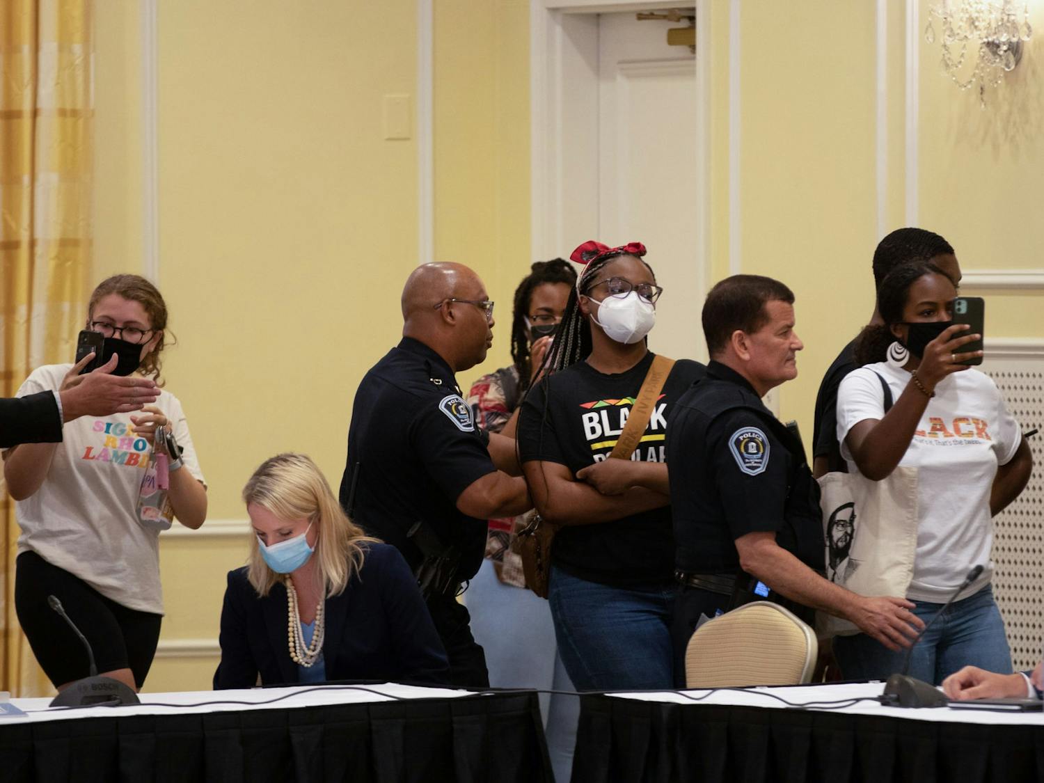Demonstrators gather at the Board of Trustees' special meeting on June 30 as the Board goes into closed session to deliberate on Nikole Hannah-Jones' tenure case.