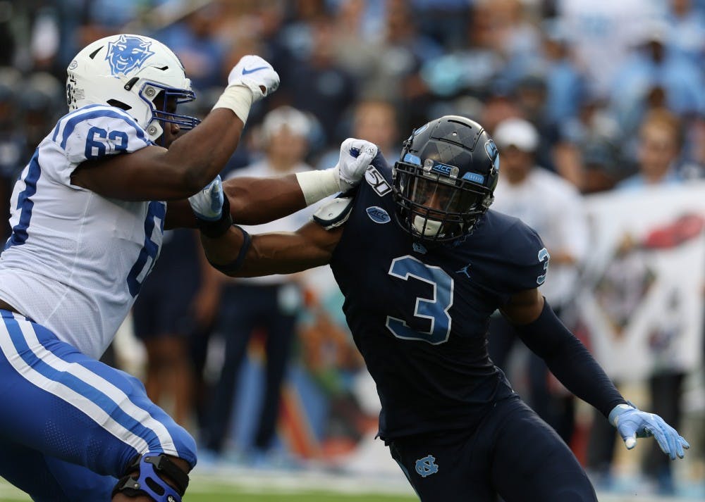 UNC linebacker Dominique Ross (3) attempts to rush past Duke offensive tackle Jacob Monk (63) during the football game on Saturday, Oct. 26th, 2019 at Kenan Memorial Stadium.