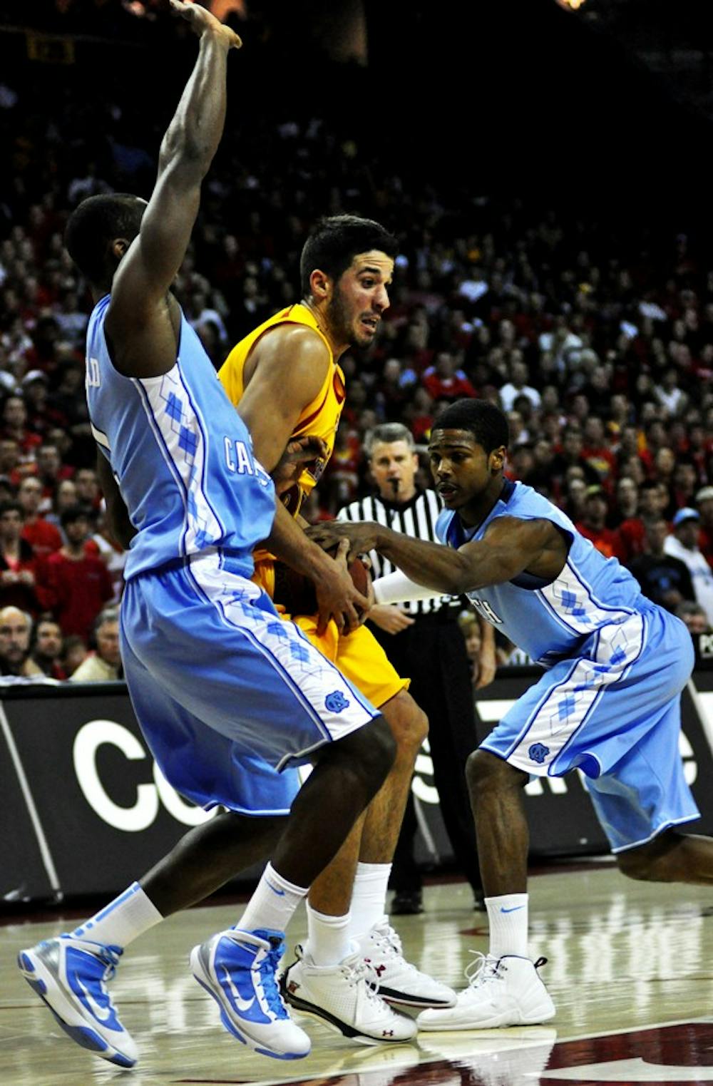 Dexter Strickland attempts to strip the ball from Maryland's Greivis Vasquez. Courtesy of Jaclyn Borowski/The Diamondback