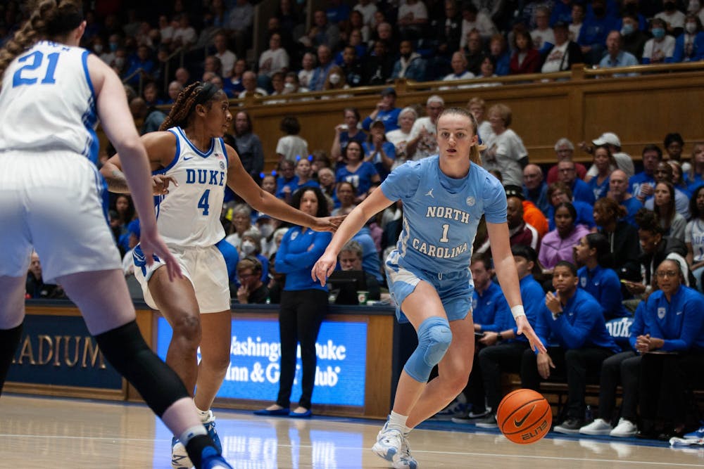 <p>UNC junior guard Alyssa Utsby (1) dribbles the ball during the women’s basketball game against Duke on Sunday, Feb. 26, at Cameron Indoor Stadium. UNC defeated Duke 45-41, and will try and earn its third win over the Blue Devils in the ACC Tournament on Friday.&nbsp;</p>