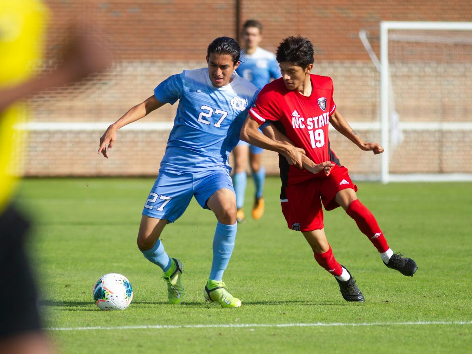 Senior defender Mark Salas (27) fights for a ball during a 0-0 draw against NC State on Sunday, Nov. 1, 2020.