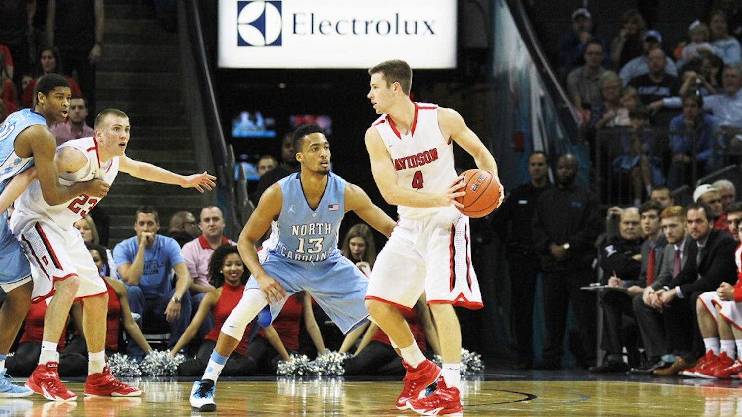 Junior forward J.P. Tokoto defends Davidson senior guard Tyler Kalinoski near the 3-point line during the Tar Heels’ 90-72 victory against the Wildcats Saturday afternoon at Time Warner Cable Arena.