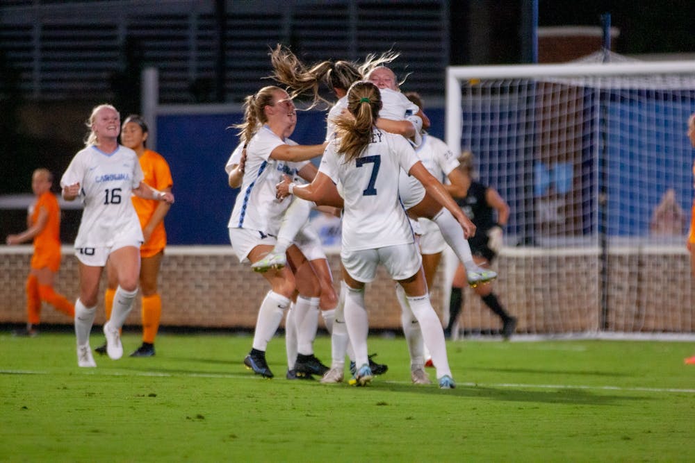 UNC players celebrate a goal at their season opener against University of Tennessee on Aug. 18, 2022. UNC won 3-0.