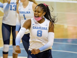 Junior middle blocker Skyy Howard (8) celebrates at the volleyball game against  Duke on Oct. 22 at Carmicahel Arena. UNC won 3-0.