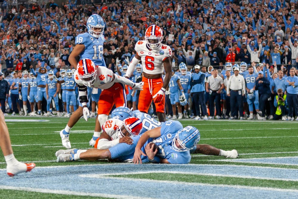 UNC redshirt first-year quarterback Drake Maye (10) scores a touchdown during the 2022 Subway ACC Football Championship Game against Clemson to begin at the Bank of America Stadium on Saturday, Dec. 3, 2022. UNC fell to Clemson 39-10.