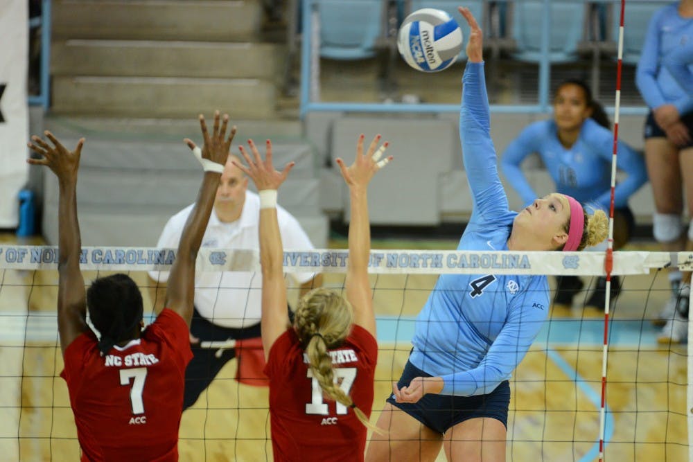 UNC outside hitter Leigh Andrew (4) hits the ball.