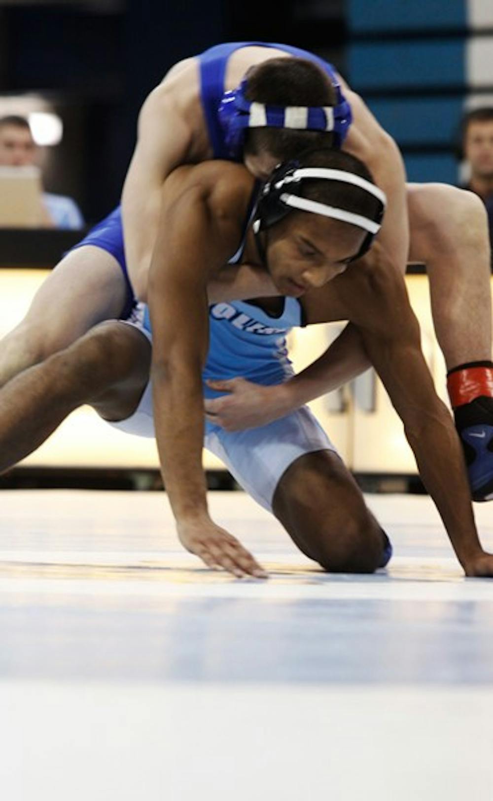 North Carolina wrestler Daniel Helena attempts to escape the hold of Duke’s Brent Jorge on Tuesday. DTH/Alyssa Champion