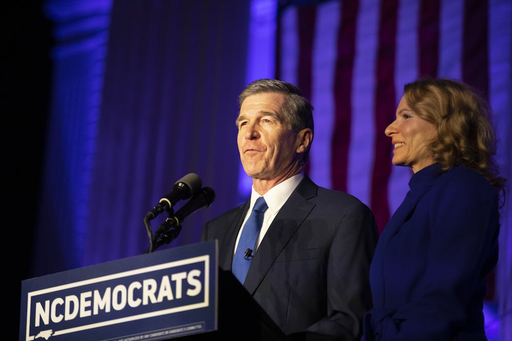 Gov. Roy Cooper and First Lady Kristin Cooper announce their victory in the 2020 election on Nov. 3, 2020 on the steps of the N.C. Democratic Party headquarters in Raleigh.