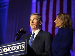 Gov. Roy Cooper and First Lady Kristin Cooper announce their victory in the 2020 election on Nov. 3, 2020 on the steps of the N.C. Democratic Party headquarters in Raleigh.