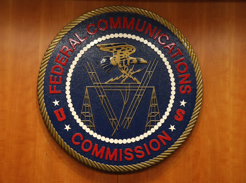 The seal of the Federal Communications Commission hangs inside the hearing room at the FCC headquarters February 26, 2015 in Washington, D.C. Photo courtesy of Mark Wilson/Getty Images/TNS