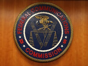 The seal of the Federal Communications Commission hangs inside the hearing room at the FCC headquarters February 26, 2015 in Washington, D.C. Photo courtesy of Mark Wilson/Getty Images/TNS