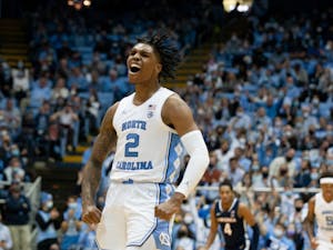 Sophomore guard Caleb Love (2) cheers after scoring at the game against Virginia at the Smith Center in Chapel Hill on Jan. 8, 2022. UNC won 74-58.