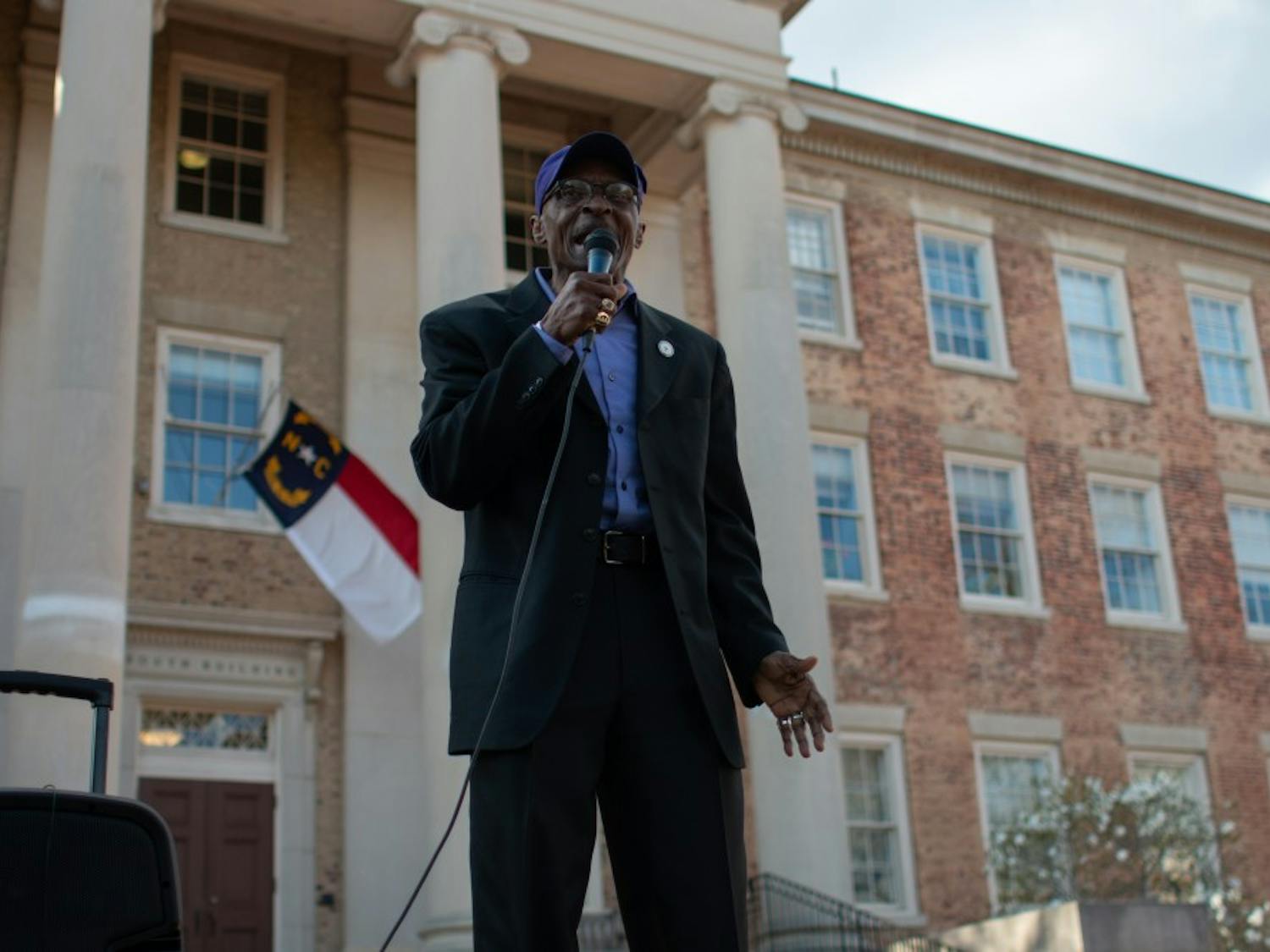 Rev. Dr. T. Anthony Spearman, 67, of Greensboro, addresses the crowd at an NAACP gathering in front of South Building on Friday, March 22, 2019. The NAACP called the demonstration to condemn the actions of UNC and UNC Police in response to an incident last week when a Confederate group brought guns to campus and were not arrested.