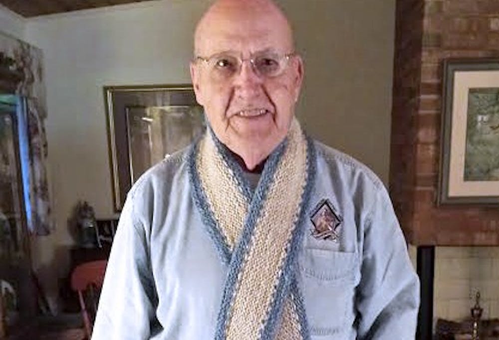 Joy Key, a UNC alumnus, spun and knit a scarf made from Rameses’ wool for her father Bernie Sheffield for Christmas. (Courtesy of Joy Key)