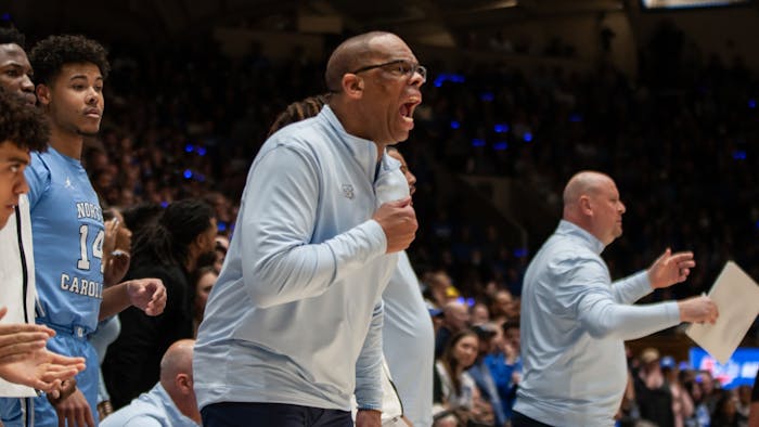 UNC Head Coach Hubert Davis shouts during the men's basketball game against Duke on Feb. 4, 2023 at Cameron Indoor Stadium. UNC lost 63-57.