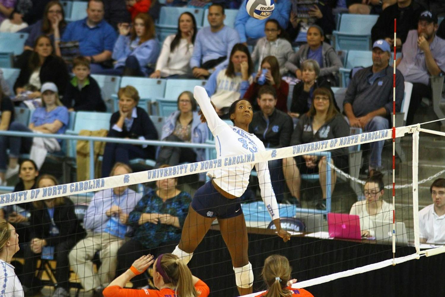 Outside Hitter, Taylor Leath (43), goes up for a hit against Clemson. The Tar Heels swept Clemson 3-0. 