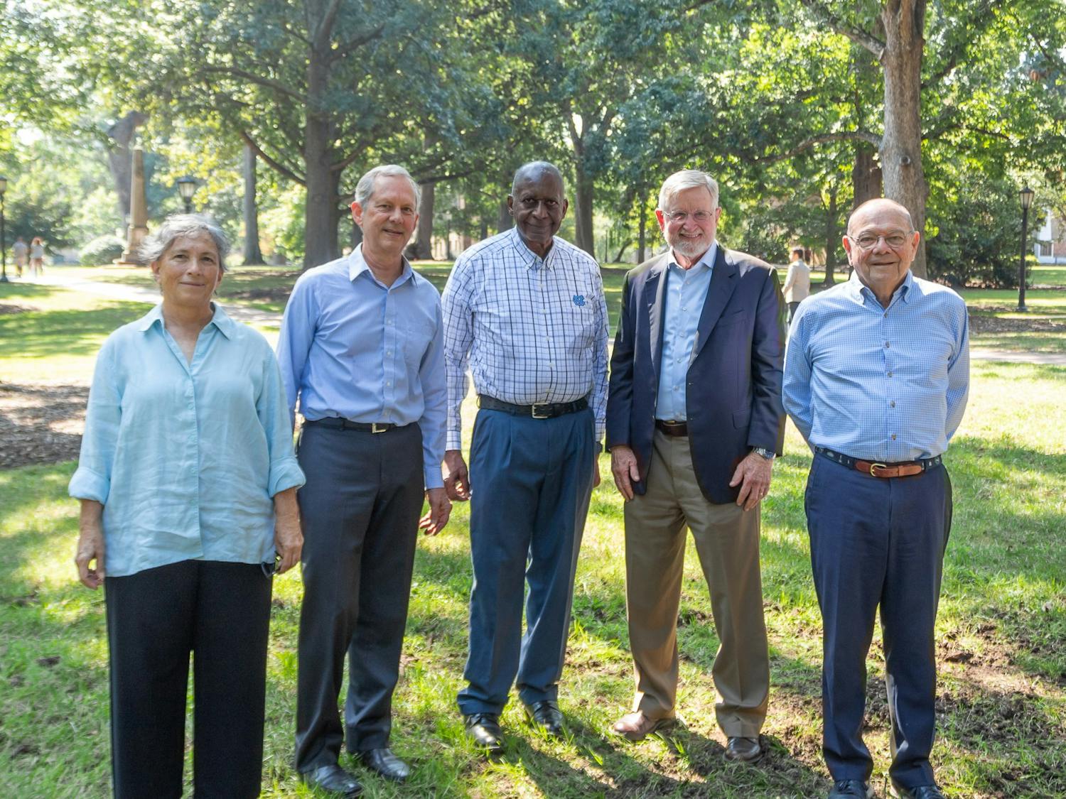 Former UNC historian Cecelia Moore, Burton Craige ('75), Walter Jackson ('67), Bill Taylor ('66), and Hugh Stevens ('65), the core conspirators behind the Silent Sam lawsuit, stand atop the area where the former Confederate Monument once sat on Friday, Sept. 16. 2022.
