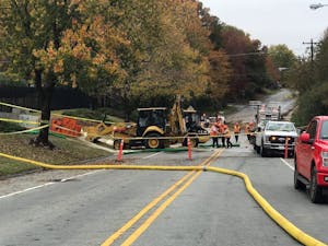 Jones Ferry Road is closed between Bim Street and Barnes Street in Carrboro while crews are on site working on a main water line break Monday, Nov. 5, 2018.&nbsp;