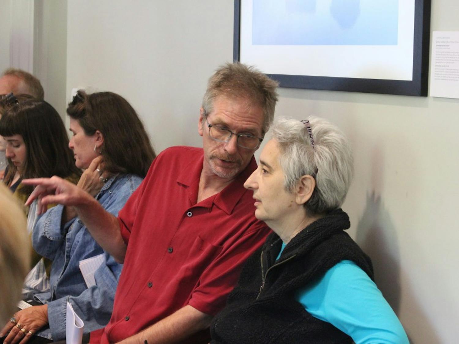 Jay Smith, a history professor at UNC, talks to Sherryl Kleinman, a sociology professor, during the faculty executive committee meeting on April 22, 2019. Smith wrote a memo regarding campus police conduct and student safety that was discussed at the meeting. 