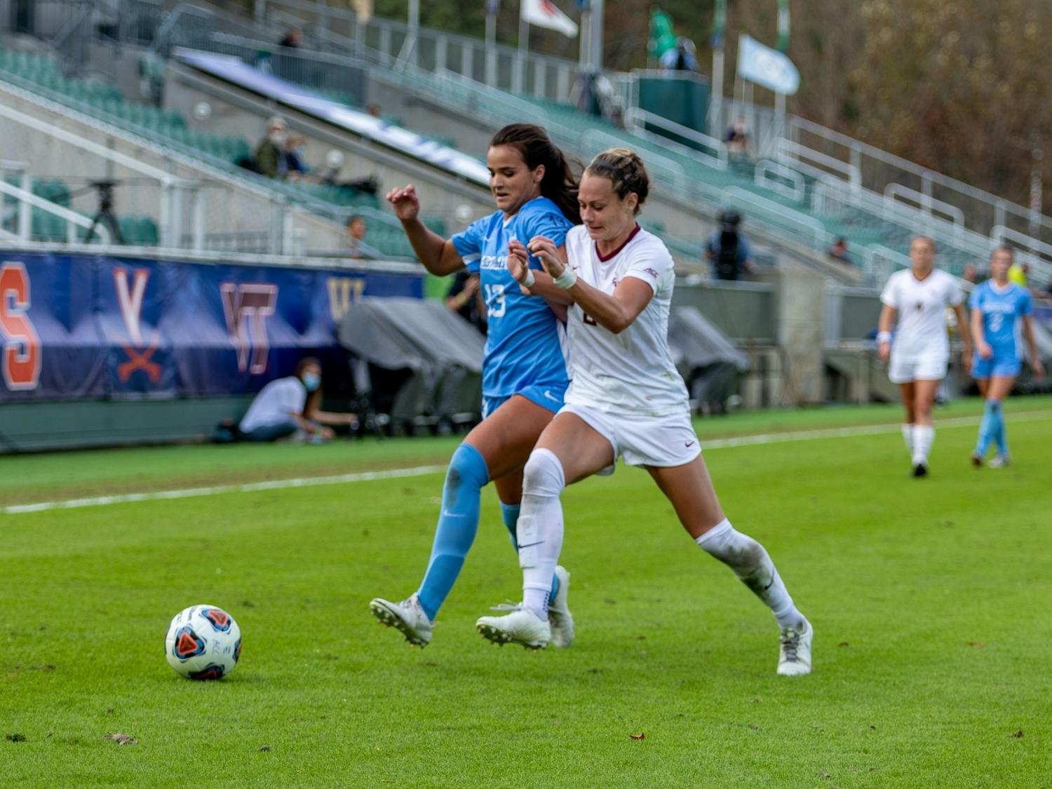 UNC sophomore forward Isabel Cox (13) drives downfield against FSU junior midfielder Jailen Howell (6) in Sahlen's Stadium in Cary, NC on Sunday, Nov. 15, 2020. The Seminoles beat the Tar Heels 3-2 to win the ACC Women's Soccer championship.