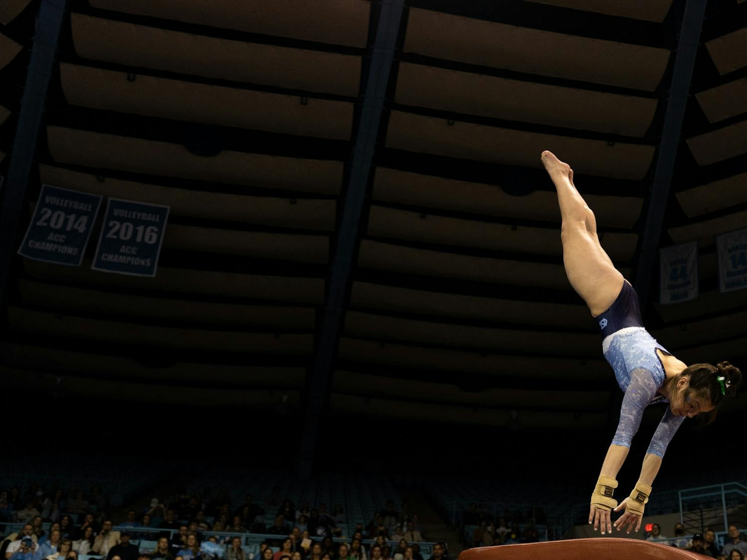 UNC first-year Gwen Fink vaults during UNC's competition against George Washington on Saturday, Jan. 28, 2023 at Carmichael Arena. UNC won 196.325-195.350.