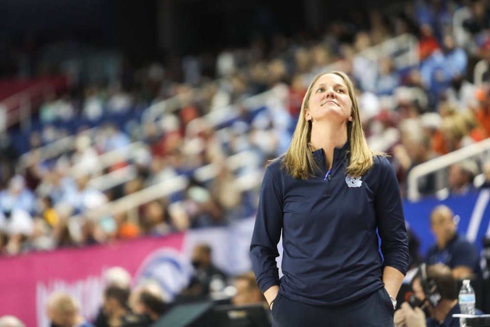 Courtney Banghart, head coach of Carolina Women's Basketball, reacts to a controversial call during a the quarterfinals of the ACC Women's Basketball Tournament against Virginia Tech at the Greensboro Coliseum. Virginia Tech won 87-80 in overtime.
