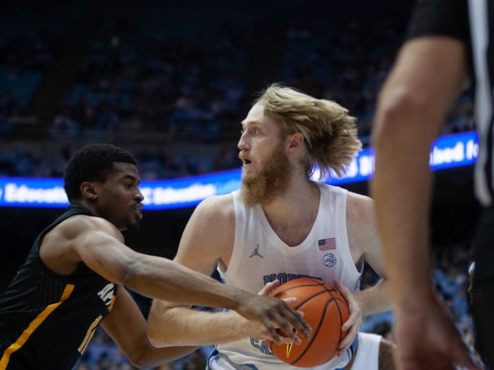 Graduate transfer forward Brady Manek (45) steals the ball at the game against Appalachian State on Dec 21, 2021 at the Dean E. Smith Center. UNC won 70-50.