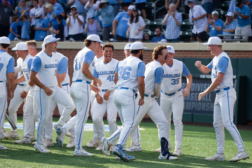 Freshman outfielder Vance Honeycutt (7) celebrates with his teammates after launching a home run in the first inning of UNC's NCAA Regional game against VCU at Boshamer Stadium on June 5, 2022. UNC won 19-8.