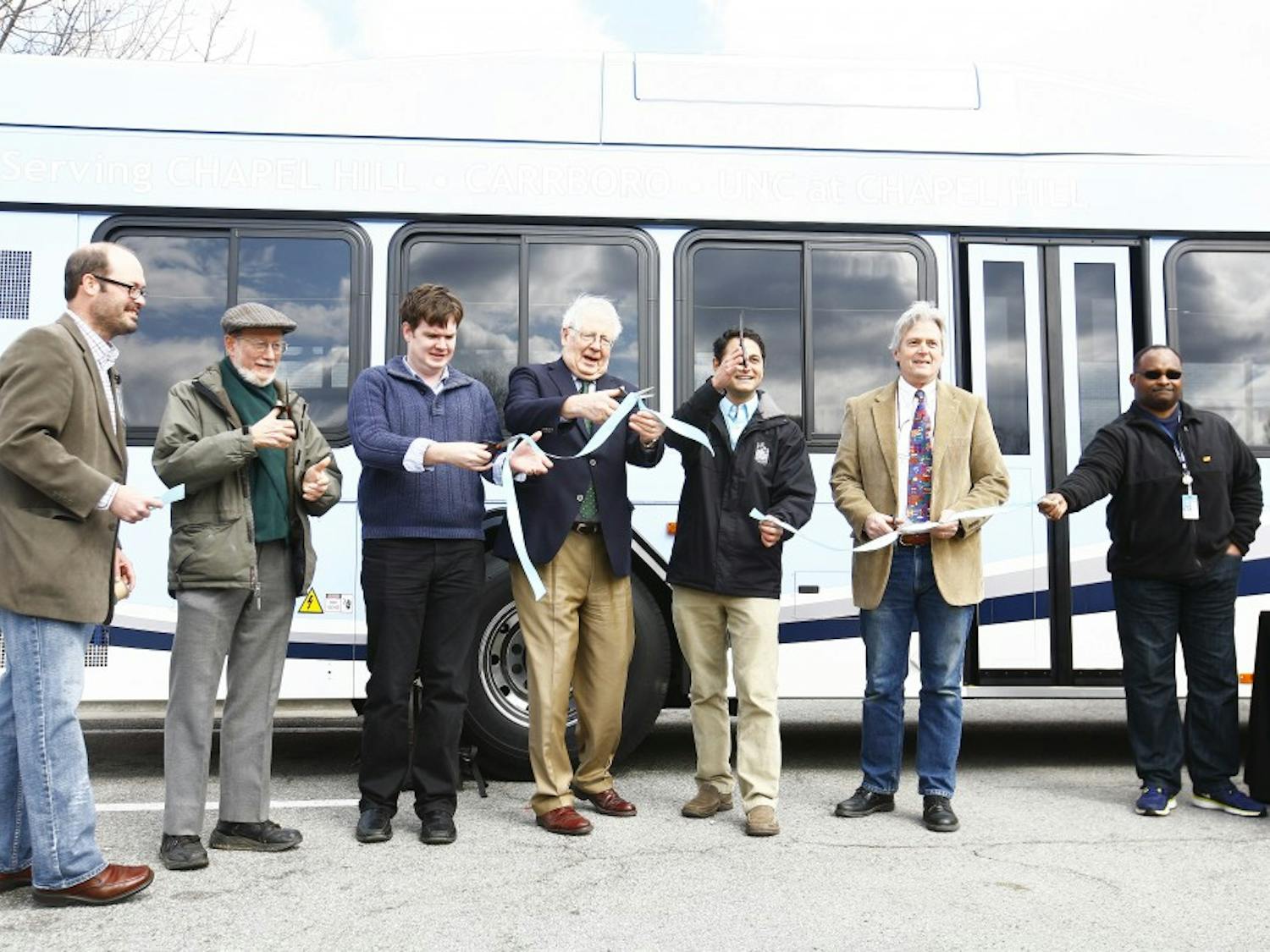 The Town of Chapel Hill unveils the 15 new hybrid-electric buses of its transit line. Chapel Hill Mayor Mark Kleinschmidt and Congressman David Price were two of the speakers at the event on Saturday afternoon at University Mall.From left: Assistant Transit Director Brian Lichtfield, Mayor Pro Temp Ed Harrison, Town Councilman Lee Storrow, Congressman David Price, Mayor Mark Kleinschimdt, Town Councilman Jim Ward and a CHT bus driver cut the ribbon to welcome in the new buses to the fleet. 
