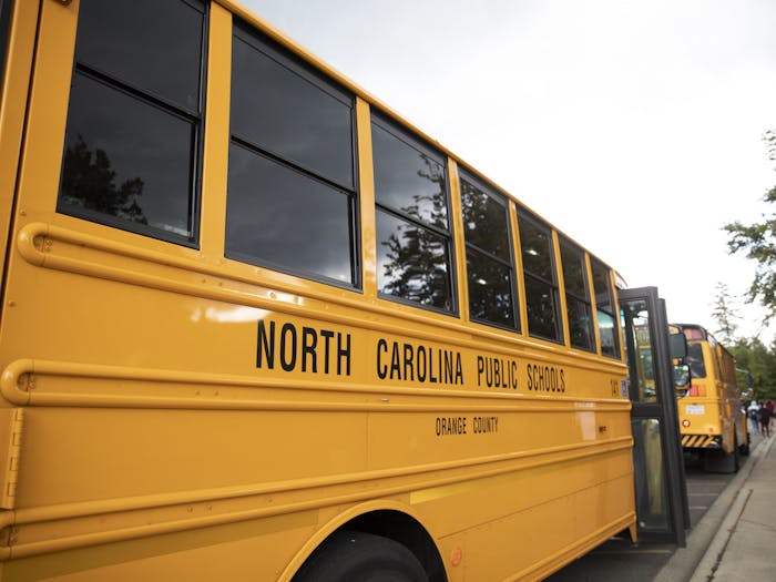 School buses await students at East Chapel Hill High School on Monday, Sept. 12, 2022.