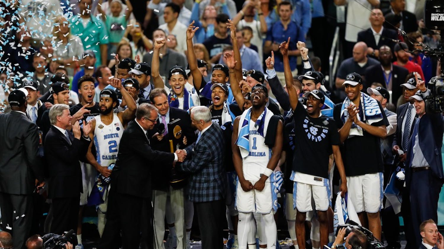 The North Carolina mens basketball team recieves the NCAA Final trophy after their win over Gonzaga in Phoenix on Monday.