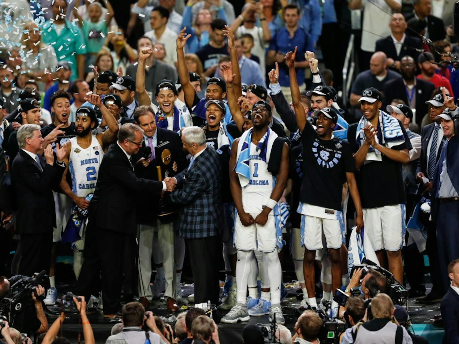 The North Carolina mens basketball team recieves the NCAA Final trophy after their win over Gonzaga in Phoenix on Monday.