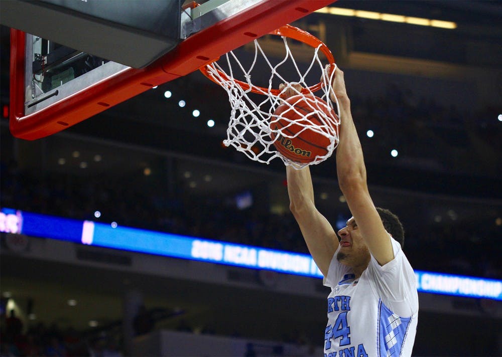 Sophomore Justin Jackson (44) dunks the ball during the ACC Tournament Championship game against Virginia on March 12.