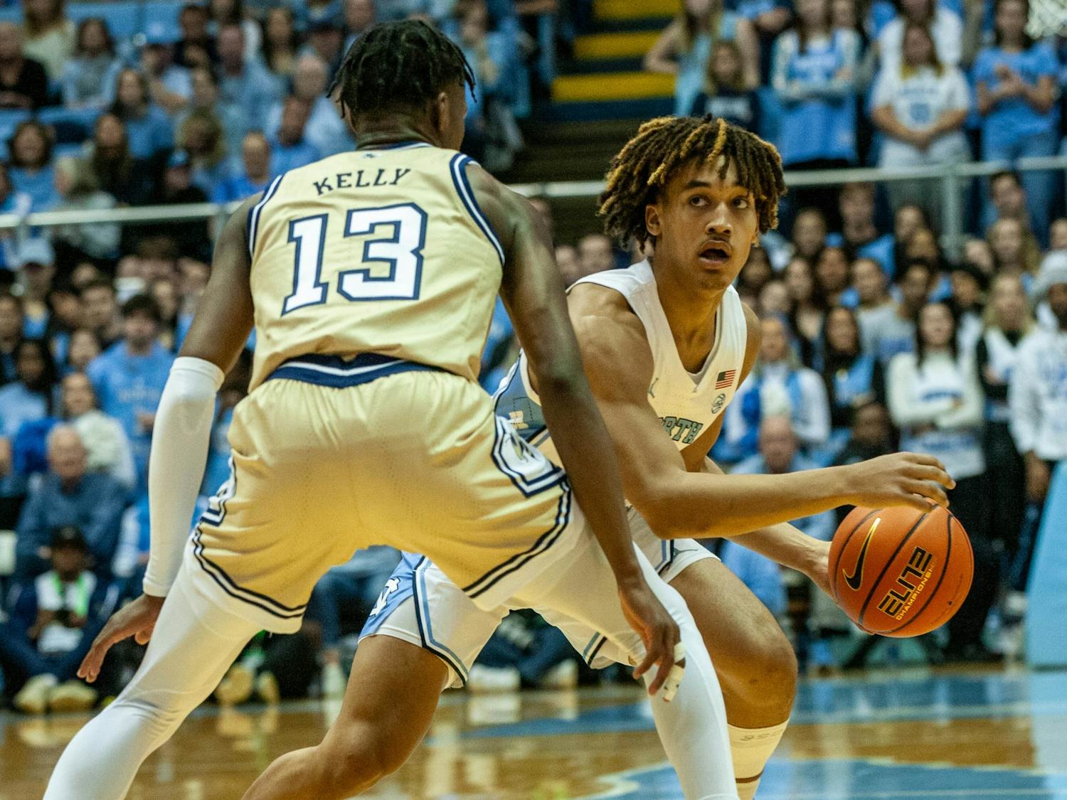 UNC first-year guard Seth Trimble (0) guards the ball from Georgia Tech sophomore guard Miles Kelly (13) during the men's basketball game against Georgia Tech in the Dean Smith Center on Saturday, Dec. 10, 2022. UNC beat Georgia Tech 75-59.