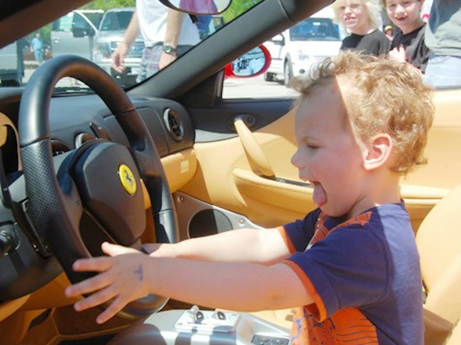 Holt Comer from Hillsboro turned his swag on in the front of a Ferrari at Touch a Truck. 