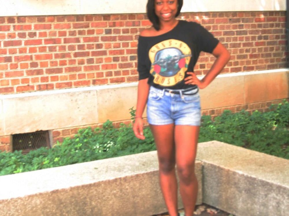 	Simone Trotman enjoys the sunny weather with a concert tee and high wasted shorts.