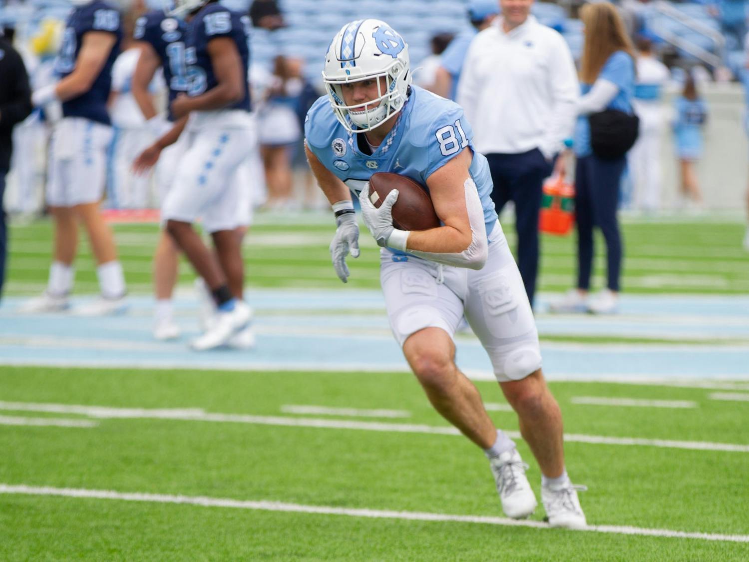 John Copenhaver (81), sophomore tight end, holds the ball during warmups for UNC football's spring scrimmage on April 9, 2022, in Chapel Hill, NC.