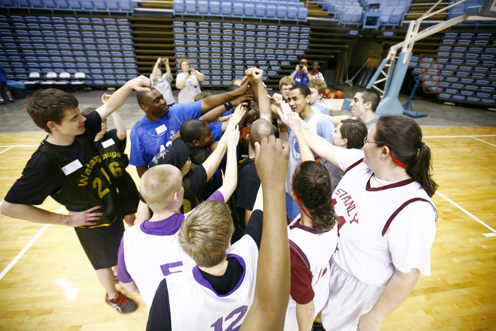 Men's Basketball team puts on a practice with special olympics basketball players from around the state. 
