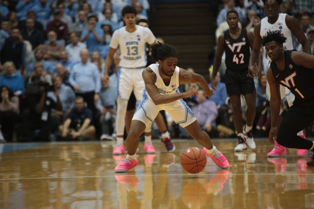 <p>UNC first-year guard Coby White lunges for the ball during the first half against No. 10 Virginia Tech on Jan. 21 at the Smith Center.</p>