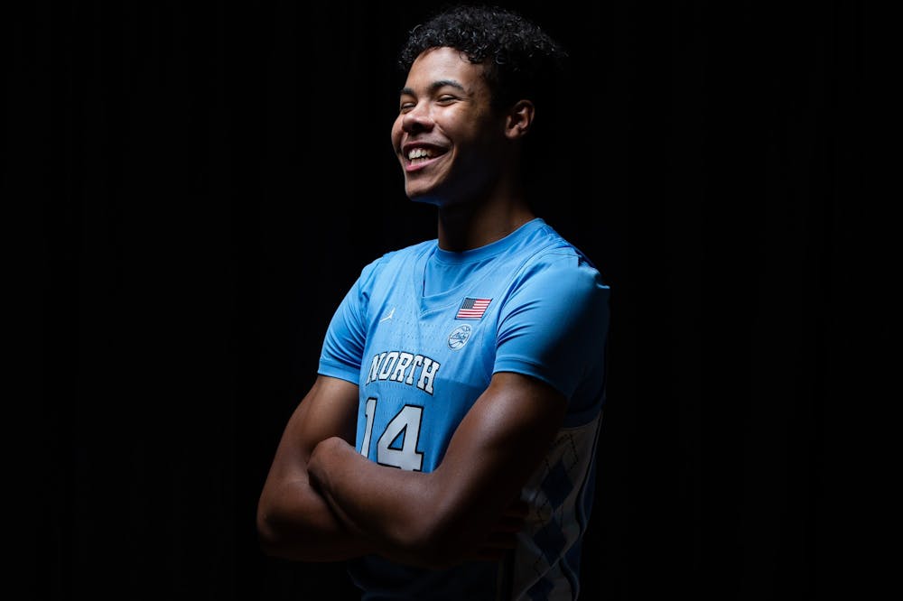 UNC first year guard Puff Johnson poses for a portrait in the Dean Smith Center on Wednesday, October 7, 2020. Photo courtesy of Morgan Pirozzi for UNC Athletic Communications.