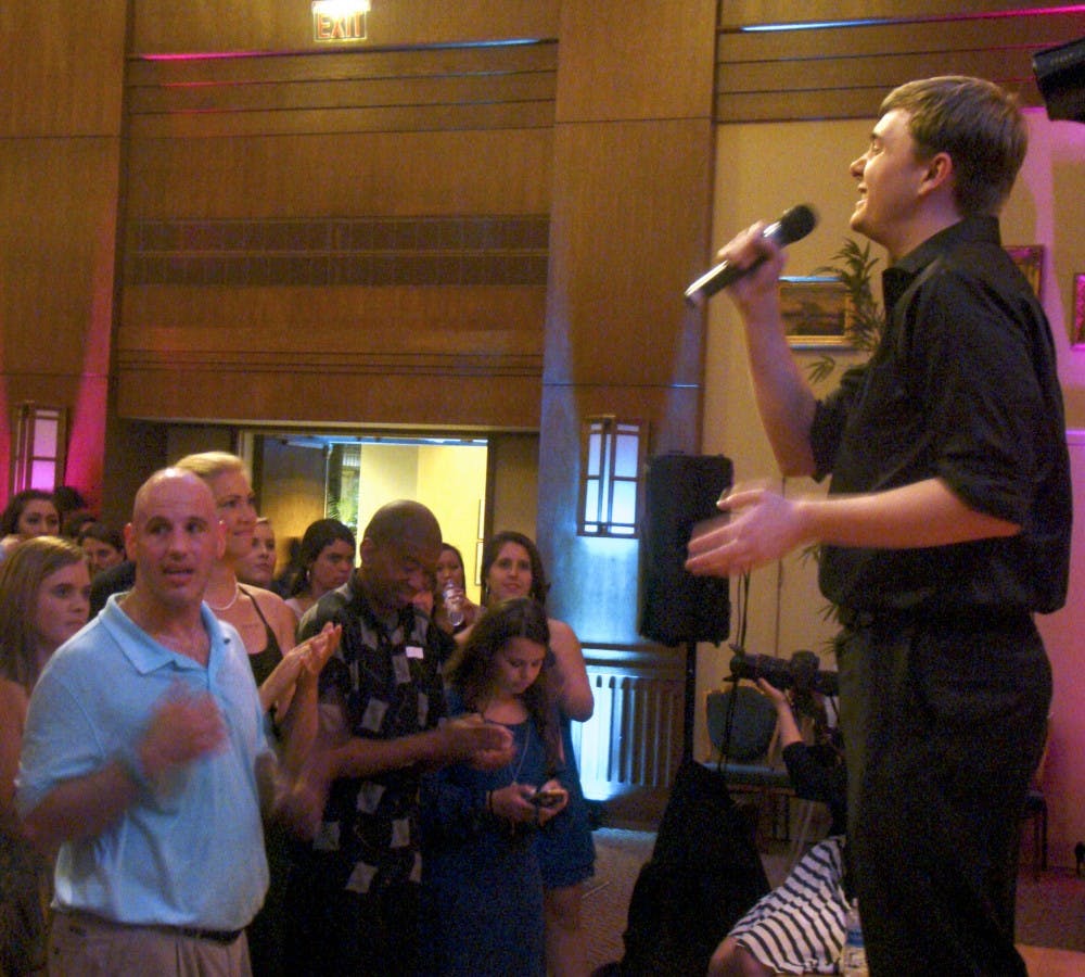 First-year Jack Hazan of the Walk-Ons sings acapella at the 2nd Annual Joy Prom on Thursday night at the Alumni Center.