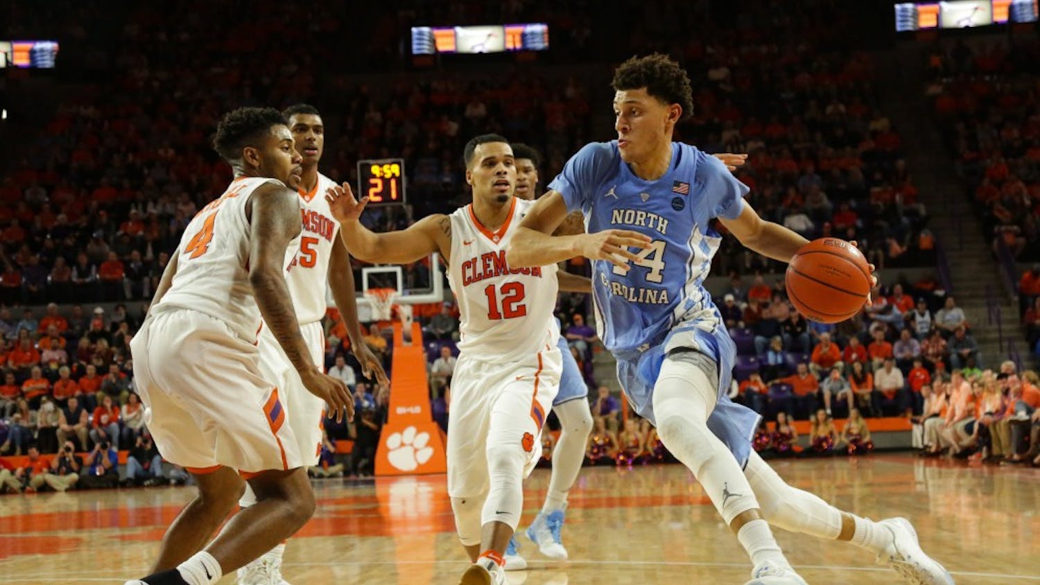 UNC-CH forward Justin Jackson (44) drives to the basket against Clemson on Tuesday night.