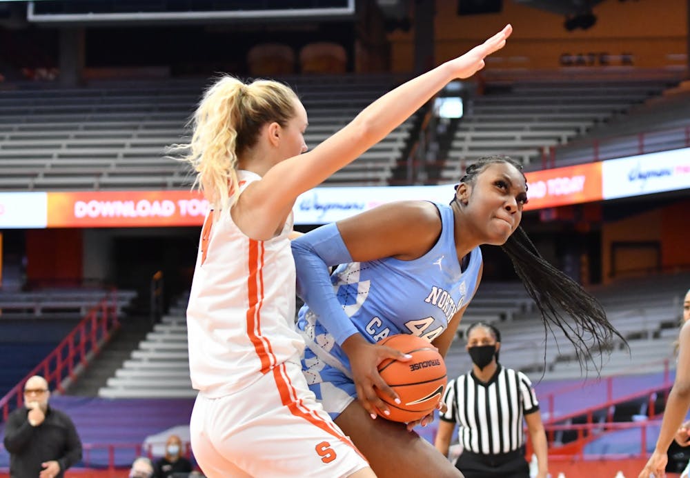 Jan 19, 2021; Syracuse, New York, USA; North Carolina Tar Heels center Janelle Bailey (44) looks to shoot as Syracuse Orange forward Digna Strautmane (45) defends in the third quarter at Carrier Dome. Photo courtesy of Mark Konezny-USA TODAY Sports