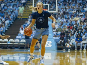 Sophomore guard Alyssa Ustby (1) dribbles during the scrimmage against her teammates at Late Night on Oct. 15 at the Dean E. Smith Center in Chapel Hill.