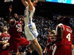 Tyler Hansbrough scored 27 points as the Tar Heels burried the N.C. State Wolfpack 89-80 Wednesday night in Chapel Hill. It was Hansbrough?s 72nd game with 20 or more points"" the most in NCAA history.