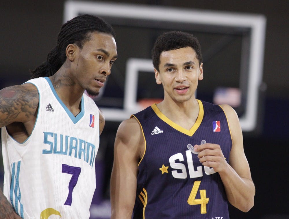 Former UNC guard Marcus Paige (4) returned to the state with the Salt Lake City Stars to take on the Greensboro Swarm. Greensboro defeated Salt Lake City 104-99. Here, Paige talks with former N.C. State guard Cat Barber (7).&nbsp;