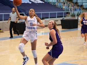 UNC graduate student guard Stephanie Watts (5) goes for a layup during game against High Point on Sunday, Nov. 29, 2020 in Carmichael Arena.