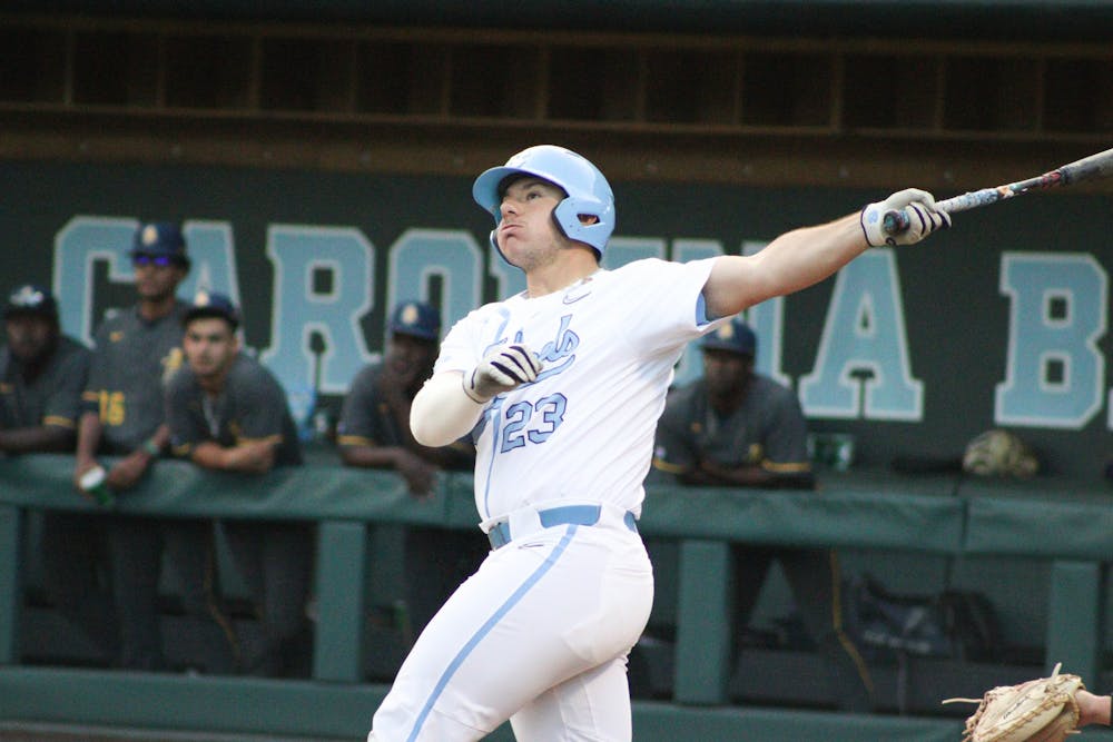 Designated hitter Alberto Osuna (23) hits a foul ball during a baseball game against North Carolina A&T. UNC lost 6-7 at home on Tuesday, April 12, 2022.