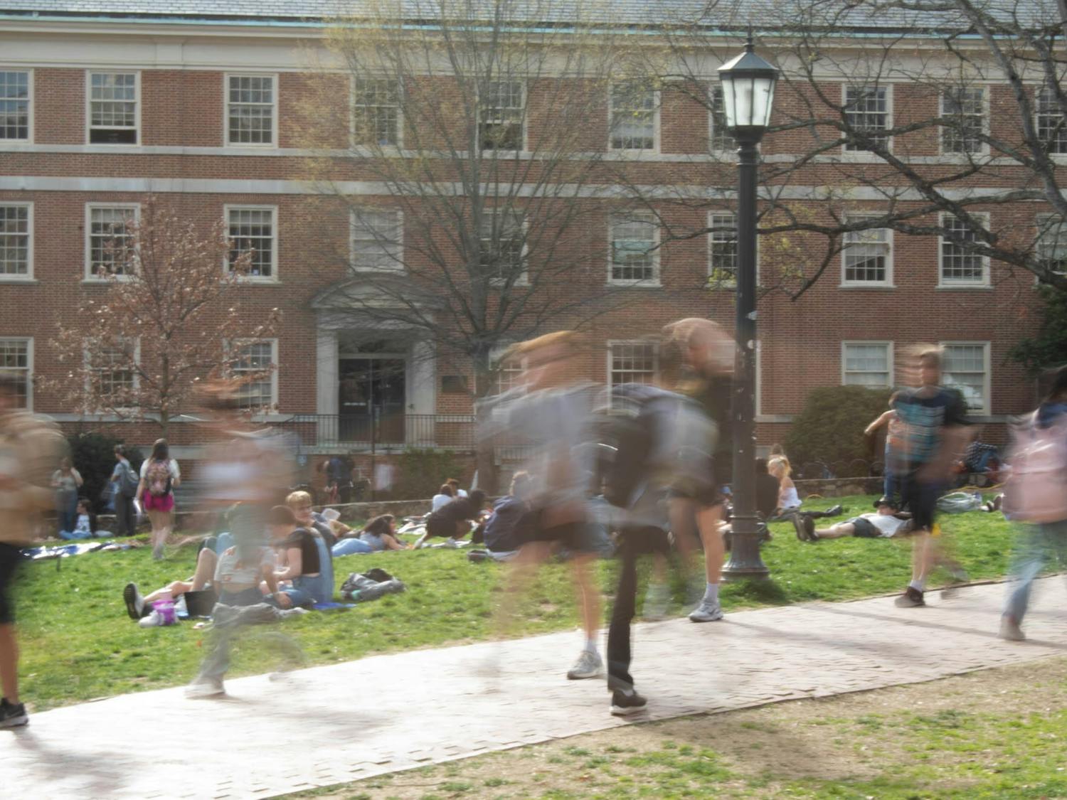 A blur of students traverses the university grounds on Monday, March 6, 2022.
