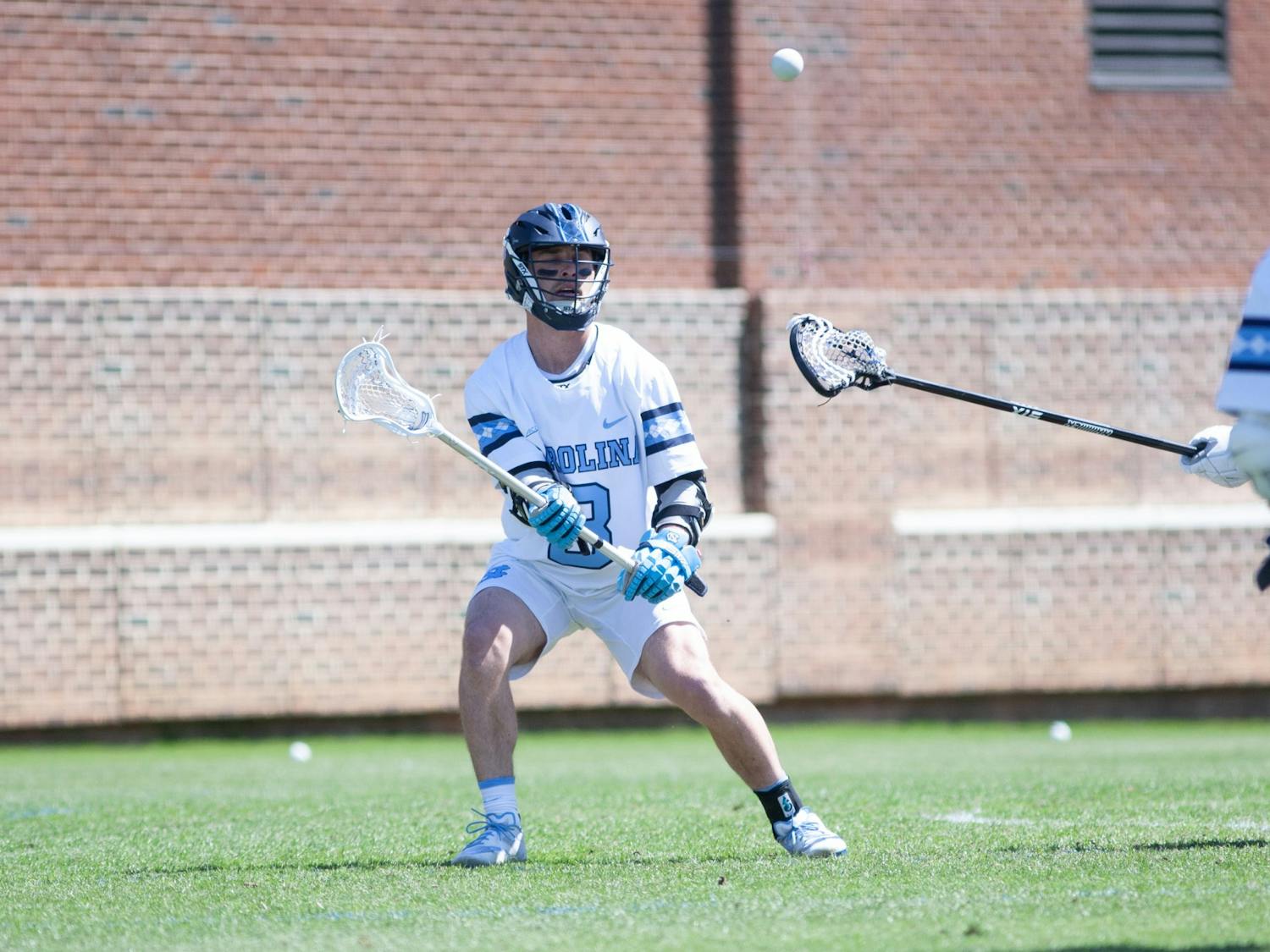 UNC senior attackman Nicky Solomon (8) passes the ball during a home game against Duke at Dorrance Field on Saturday Apr. 2, 2022.